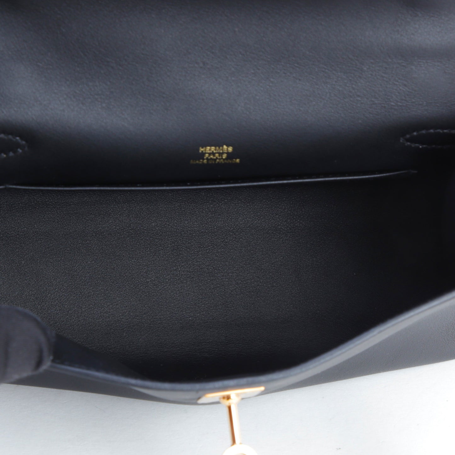 HERMÈS Hermès Pochette Kelly Black with Pink Gold Hardware